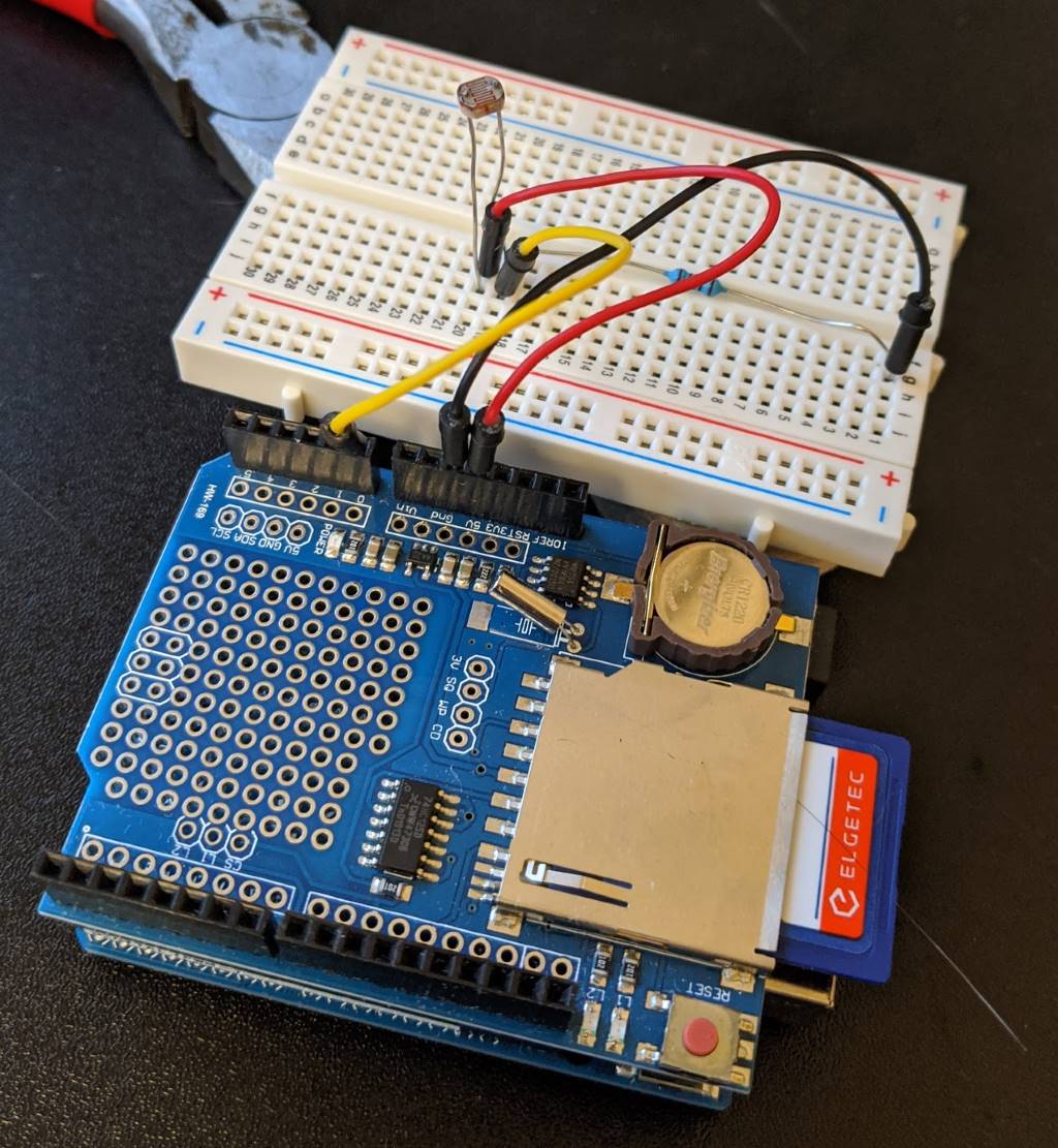 The Arduino-plus-shield connected to an LDR on a breadboard
